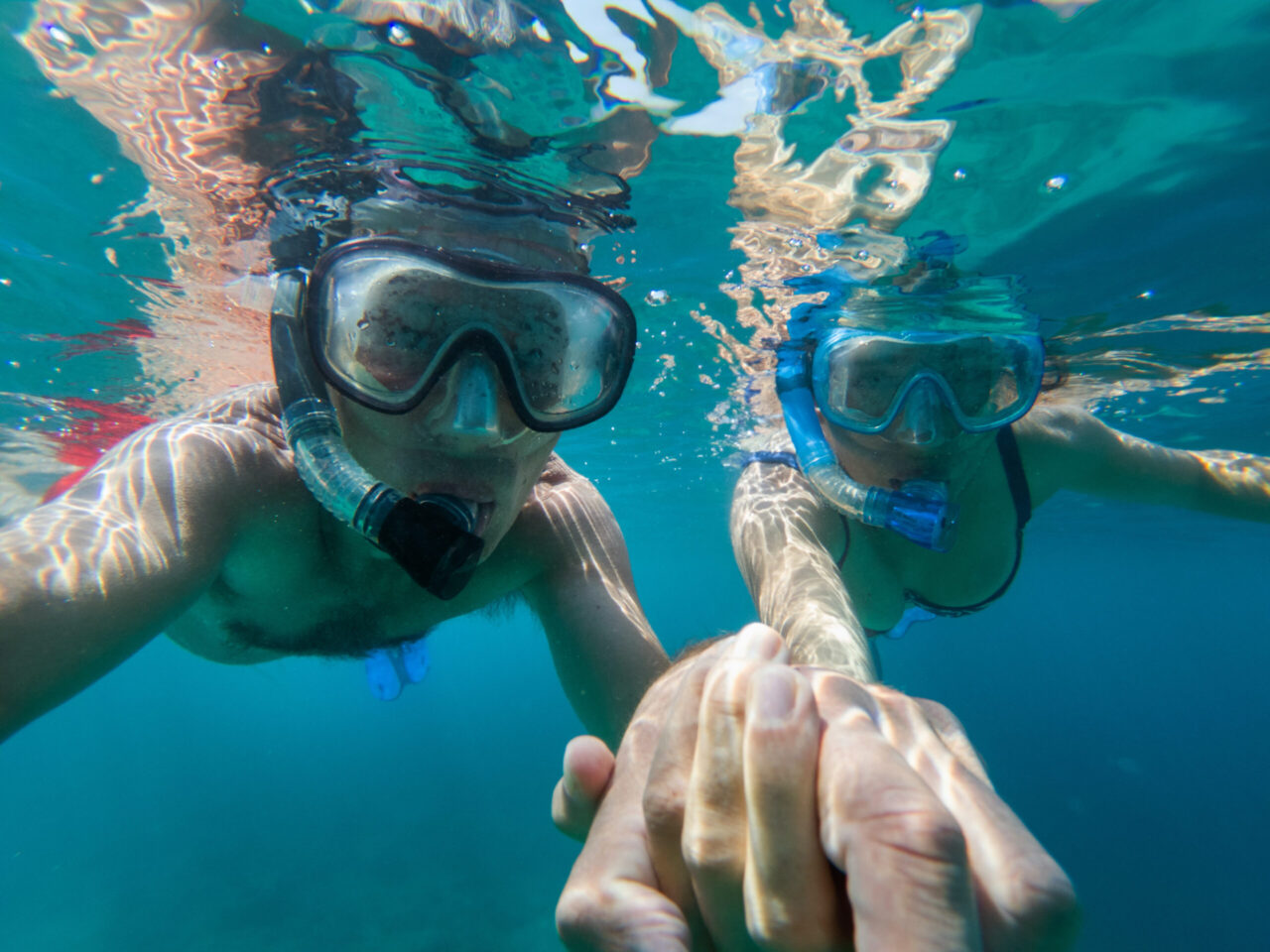 Underwater view of couple snorkeling