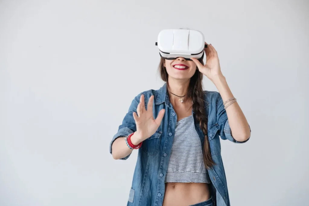 happy hipster experiencing vr glasses PEWT88V scaled e1632125145550